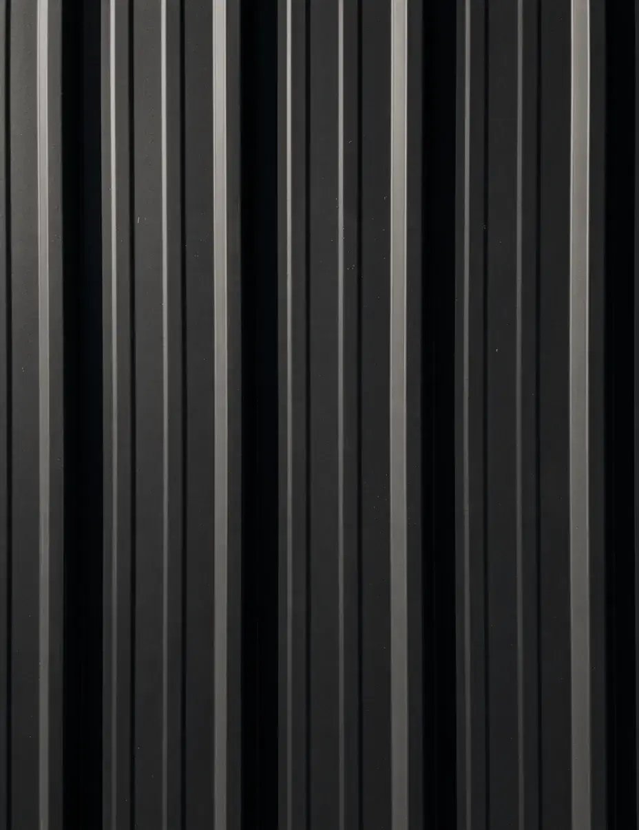 Charcoal gray standing seam metal roofing finish with light and dark vertical striations