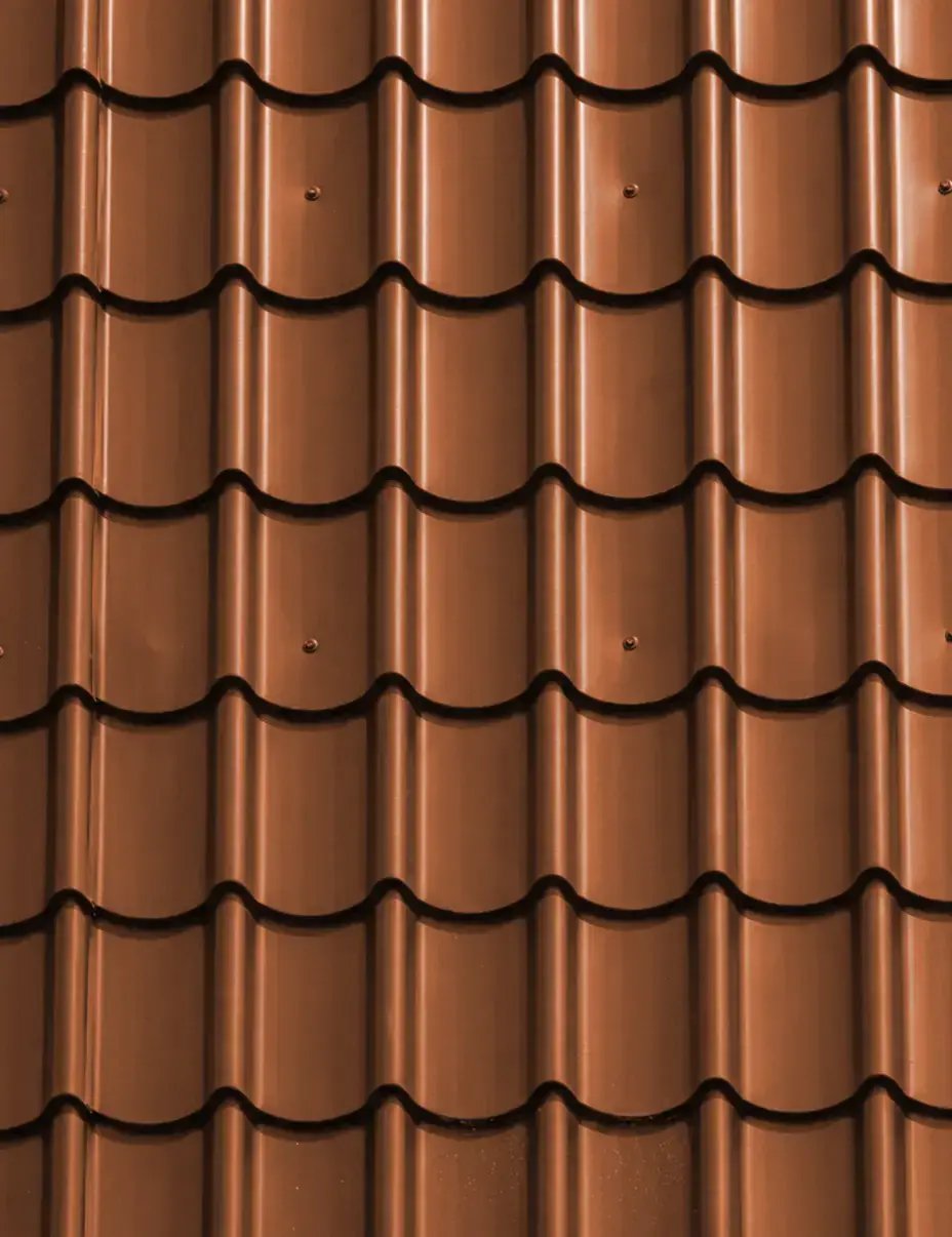 Copper penny tile-profile metal roofing color sample in a warm reddish-brown barrel-tile finish — Hybrid Renovations