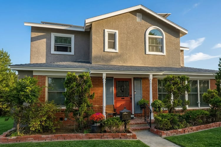 Two-tone exterior repaint with a bold coral front door in Murrieta