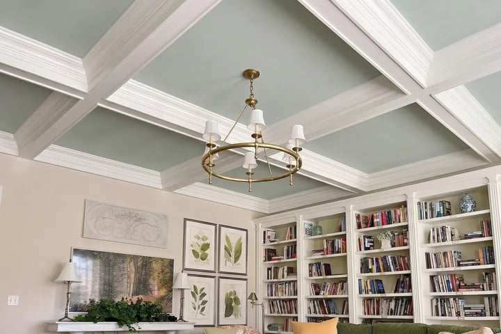 Sage-green coffered ceiling with white beams and crown molding after interior ceiling painting
