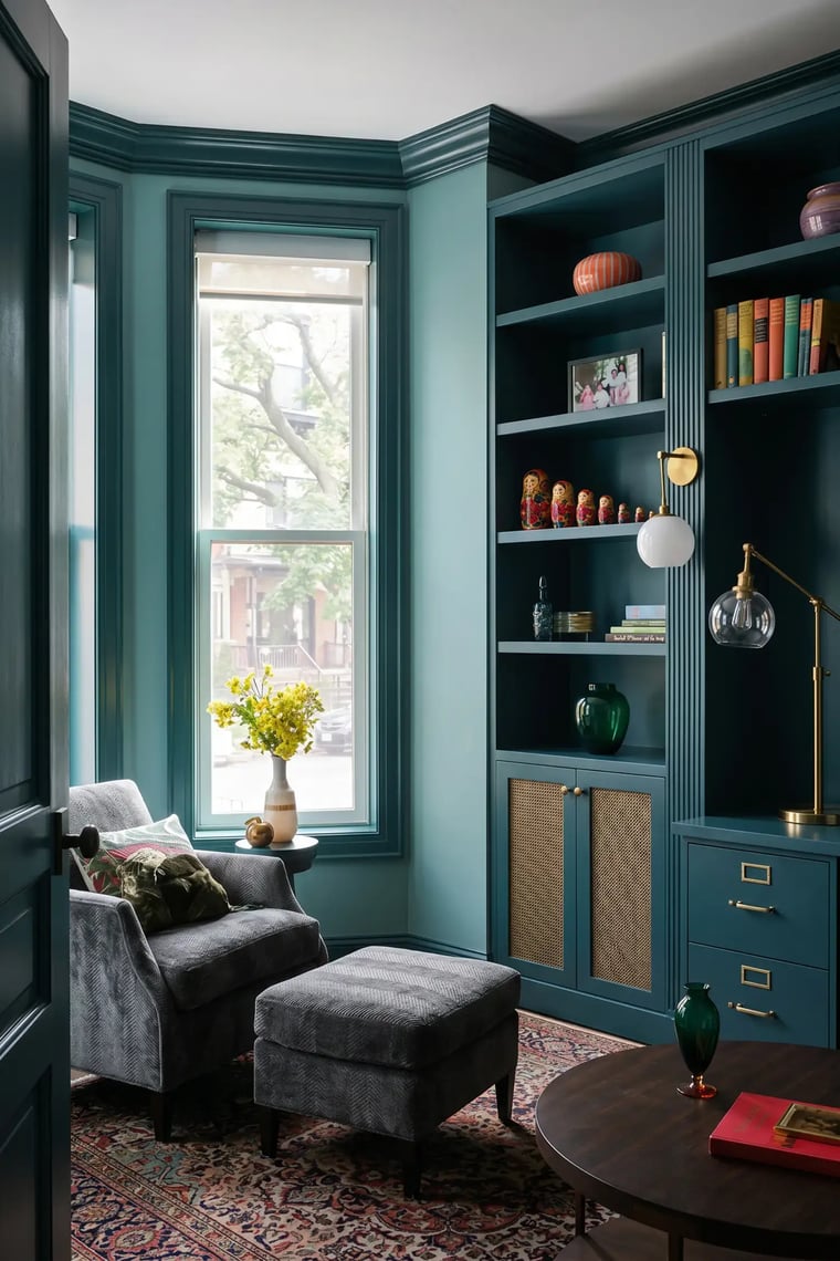 Teal home office with matching painted built-in shelves and trim after residential interior painting — Hybrid Renovations