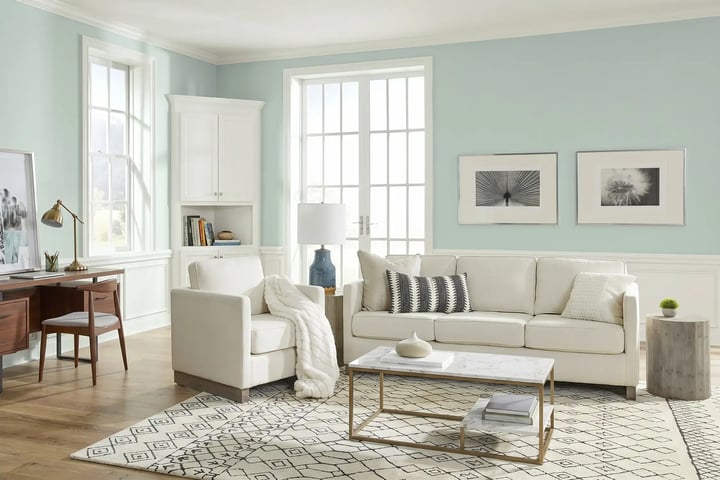 Soft blue-green living room walls with white wainscoting and trim after interior house painting