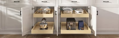 Maple pull-out shelves extended from base cabinets holding pots, jars and small appliances