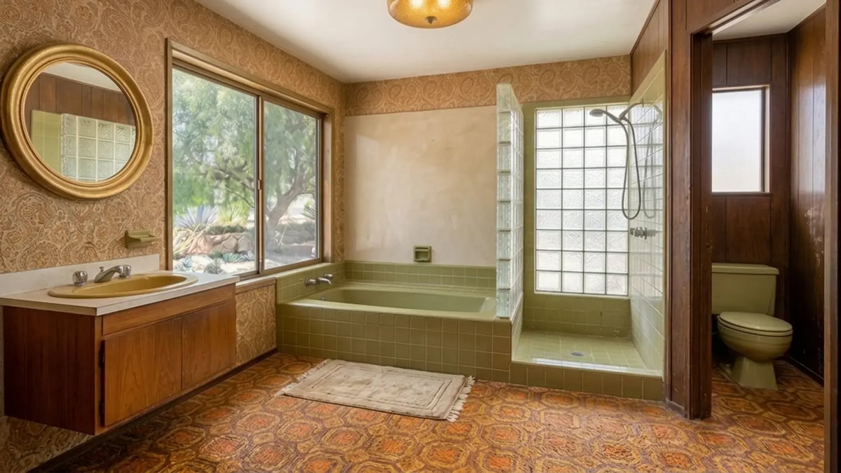 Avocado green tub, glass block shower and patterned carpet before a primary bathroom renovation