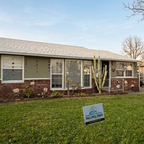 Light gray composition shingle roof after residential roof replacement on single-family home — Hybrid Renovations