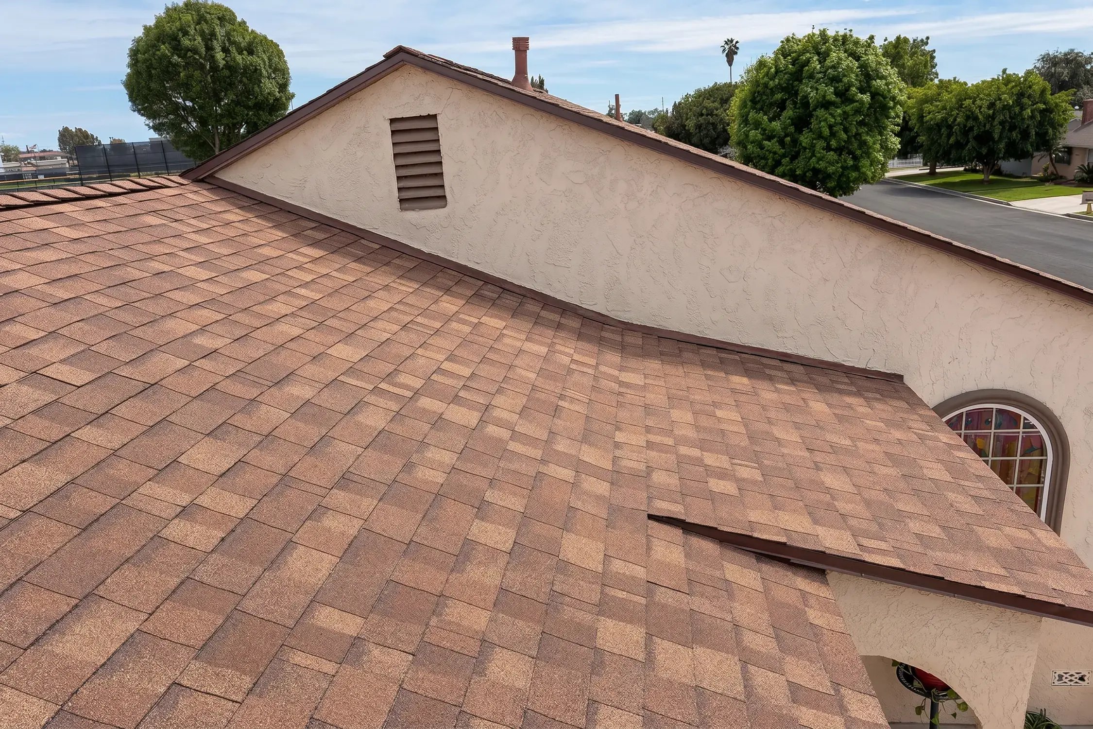 Finished brown architectural shingle roof on a single-story home after full replacement by Hybrid Renovations, La Habra