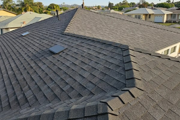 Architectural shingle reroof in charcoal with ridge venting in Whittier